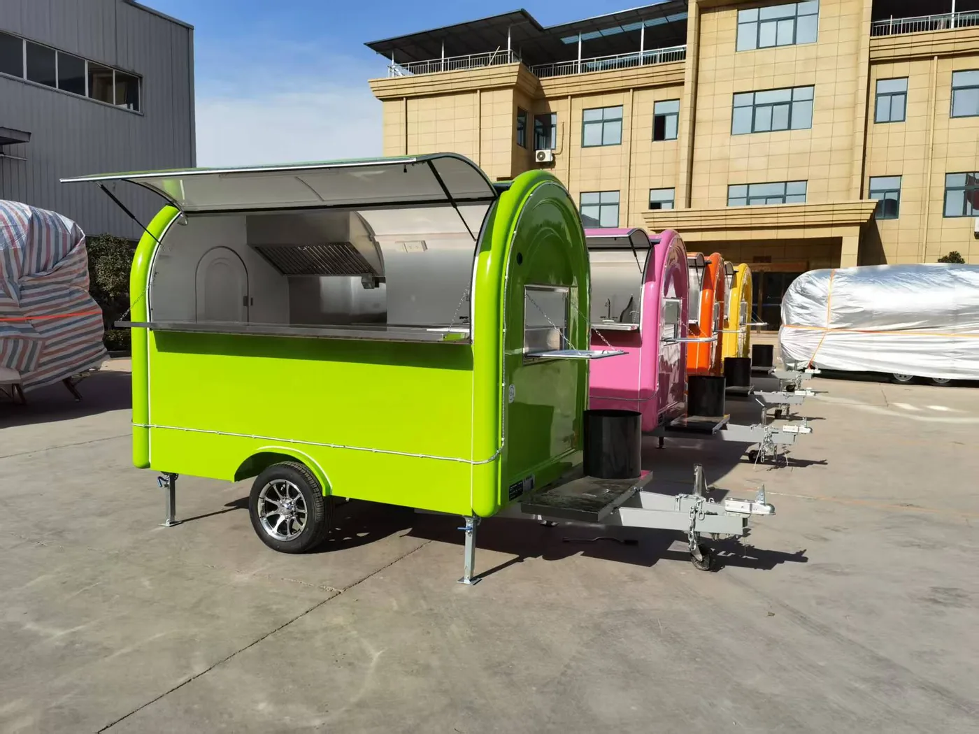 Clean mobile trailer lineup outside a factory