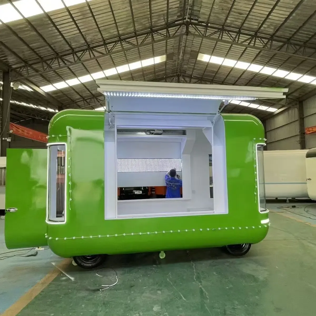 Clean green drink kiosk in a workshop
